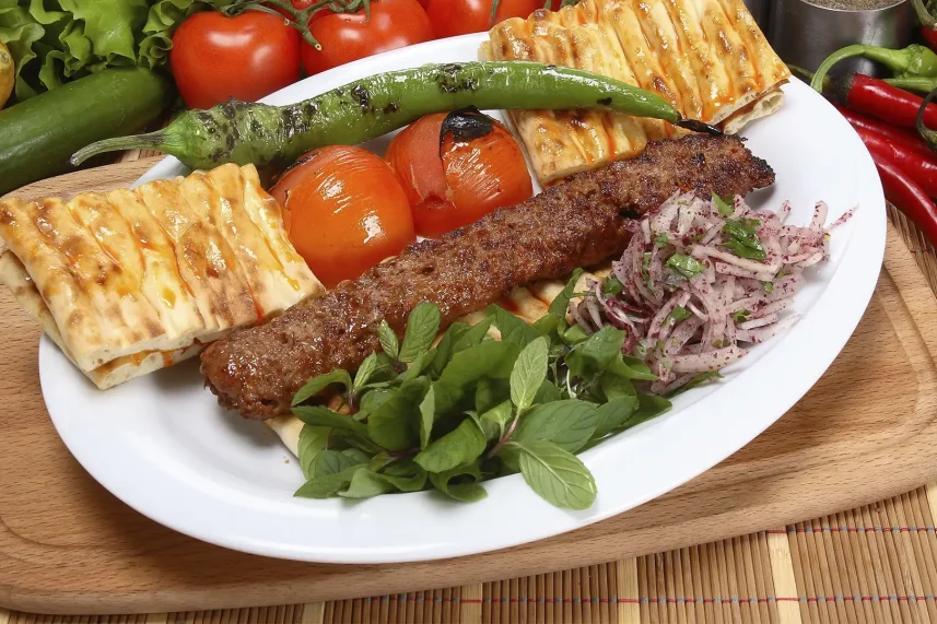 Adana Kebab, a spicy and juicy grilled meat classic from Turkish cuisine.