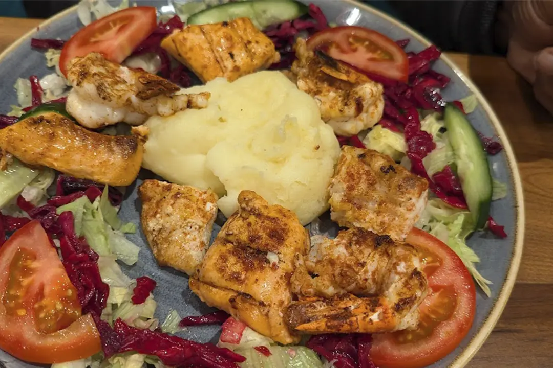 Grilled fish with fresh salad and mashed potatoes, a delicious choice at Inco Turkish Restaurant & Fish Bar.